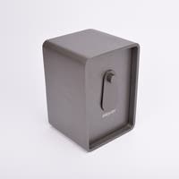 Grått fasadnyckelskåp i metall med rundade hörn och vridbar skyddskåpa.