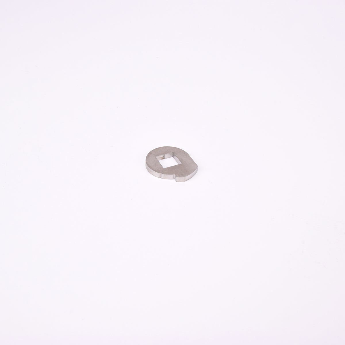 Ovalformad metallbit med fyrkantigt hål i mitten.