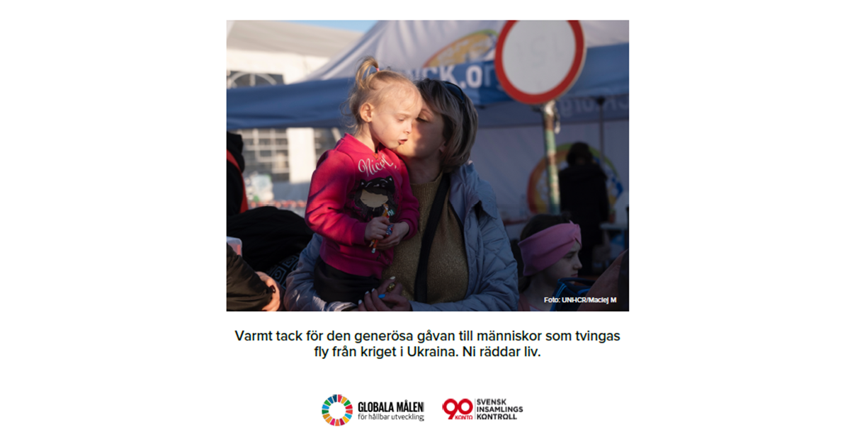 En person som håller ett barn i famnen