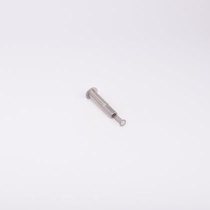 En metallisk cylinderformad komponent med en fjäder som sticker ut från ena änden.