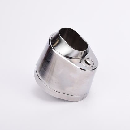 Droppformad låscylinder i silverfärgad metall med ovalt urtag samt nyckelhål i nedre delen.