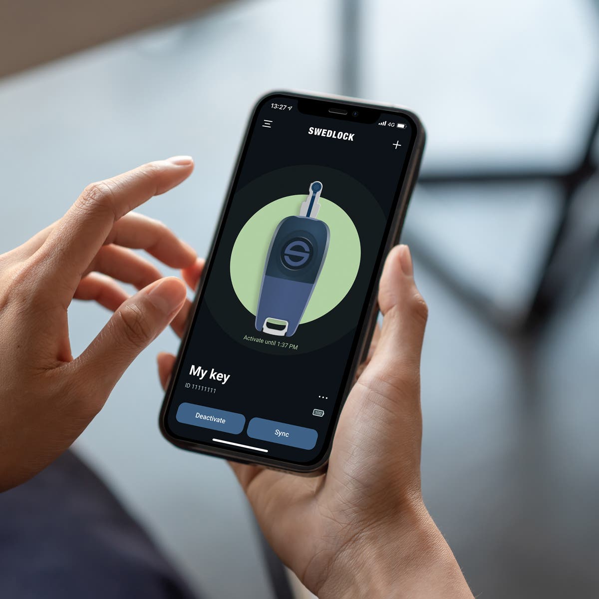 En Swedlock-nøkkel som oppdateres via Bluetooth® på mobiltelefonen