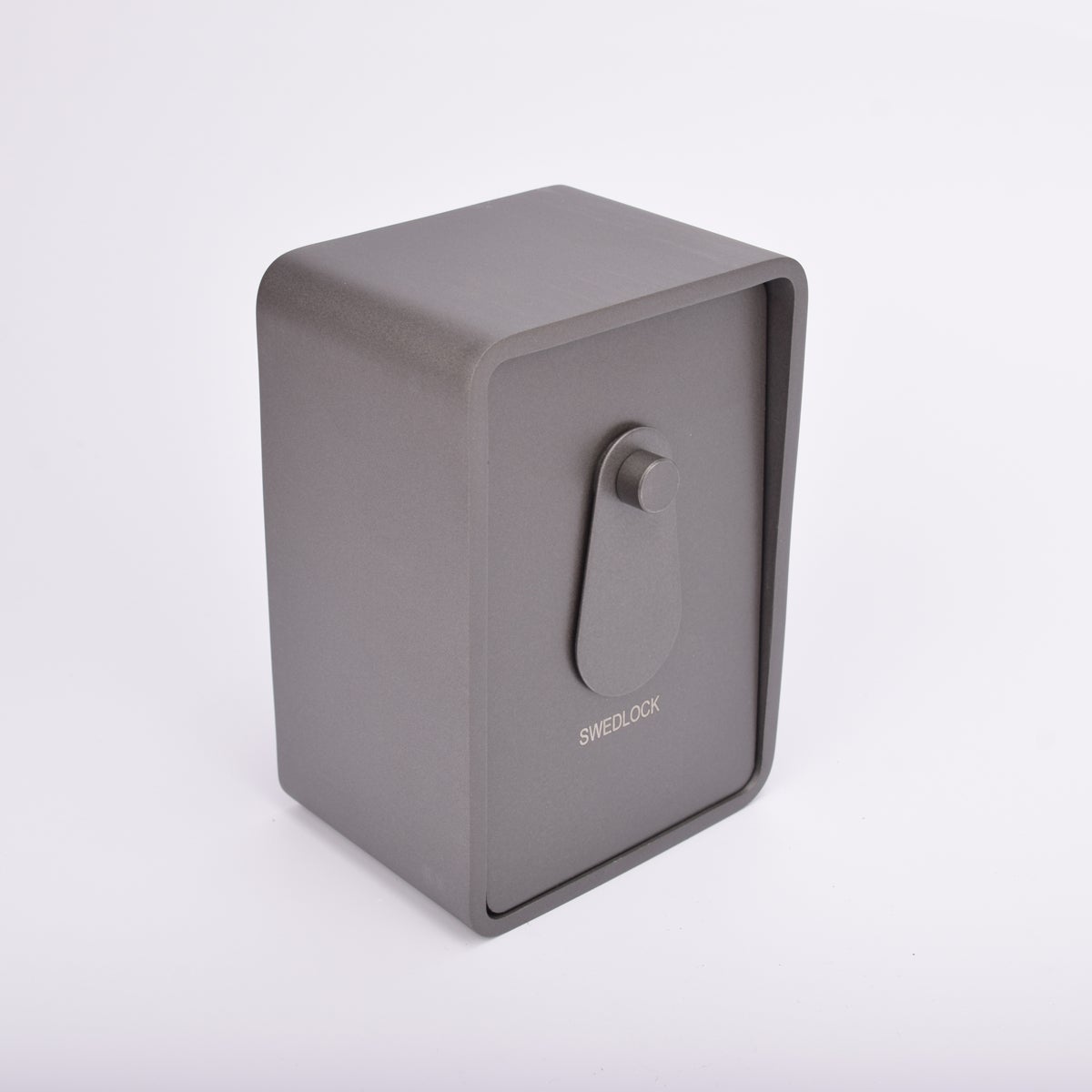 Grått fasadnyckelskåp i metall med rundade hörn och vridbar skyddskåpa.