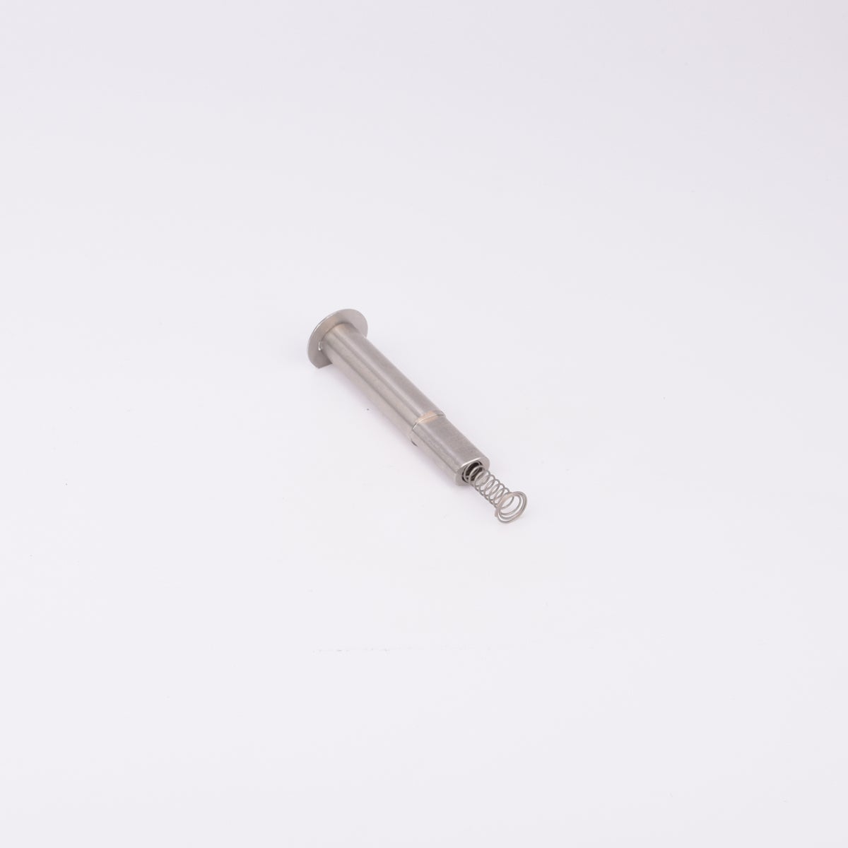 En metallisk cylinderformad komponent med en fjäder som sticker ut från ena änden.