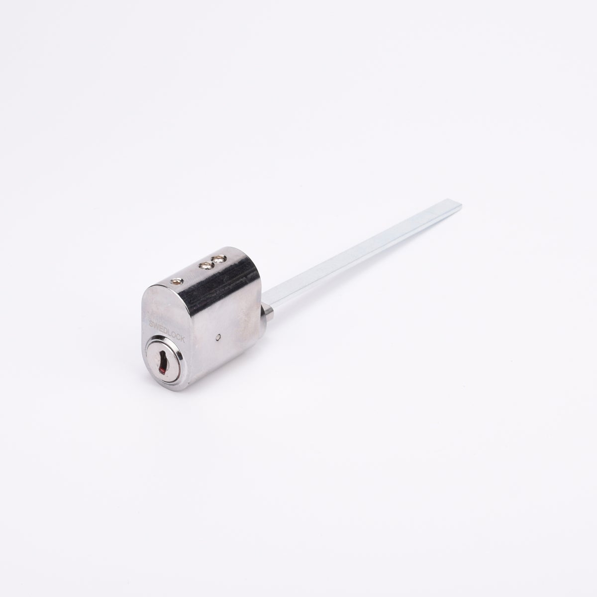 Oval låscylinder i silverfärgad metall med en lång, platt, räfflad medbringare i metall.