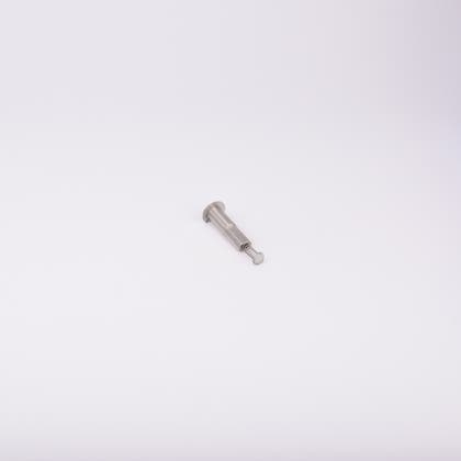 En metallisk cylinderformad komponent med en fjäder som sticker ut från ena änden.