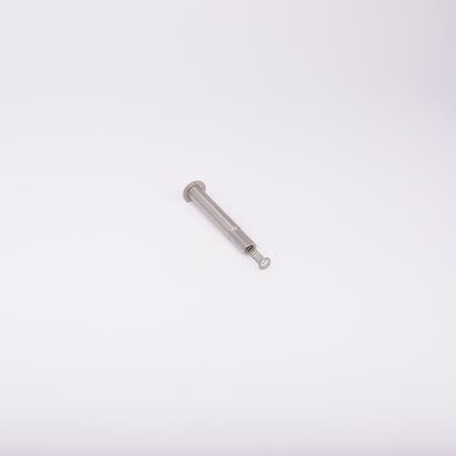 En metallisk cylinderformad komponent med en fjäder som sticker ut från ena änden.