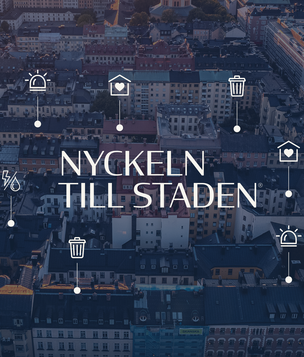 En by fra oven hvor teksten "Nøkkelen til byen" sammen med ikoner er i forgrunnen