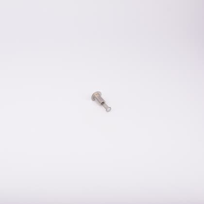 En metallisk cylinderformad komponent med en fjäder som sticker ut från ena änden.